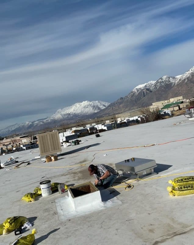 Commercial TPO Roofing Installation with Mountain Views