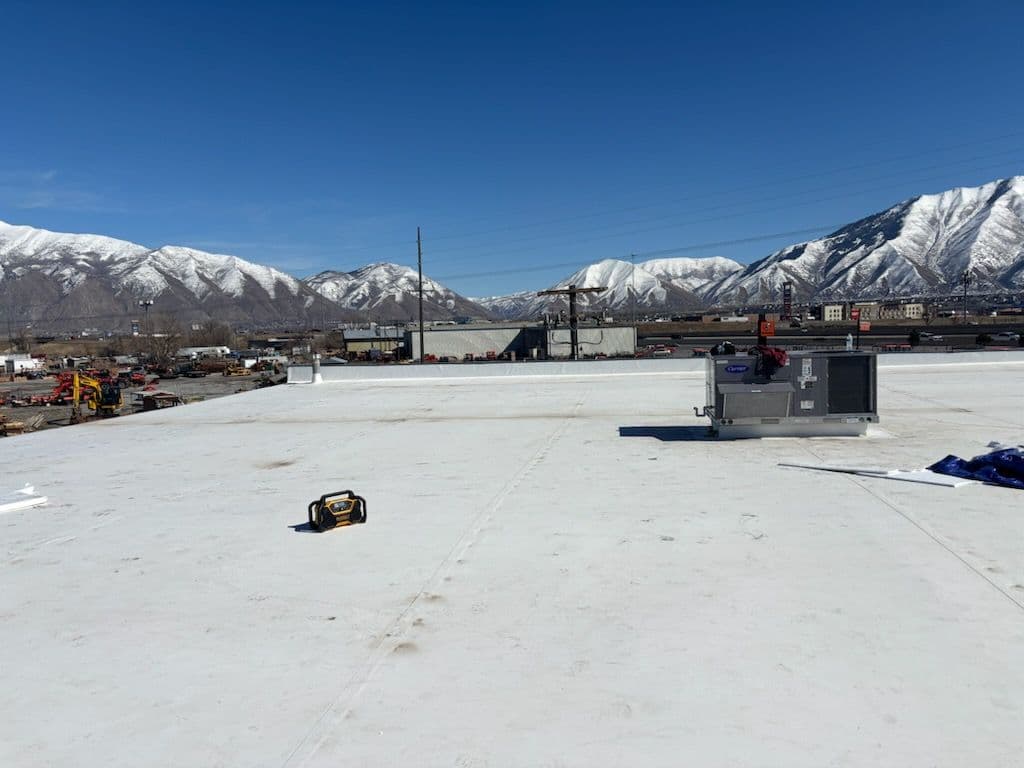 Commercial TPO Roofing Installation with Mountain Views