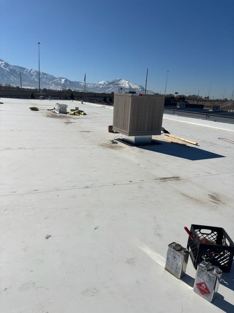 Commercial TPO Roofing Installation with Mountain Views